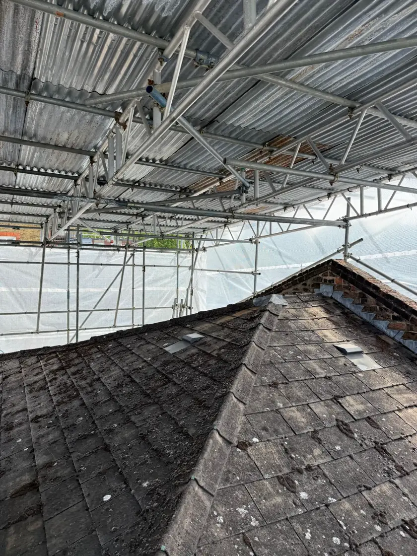 Temporary Curtis Scaffolding above yellow house